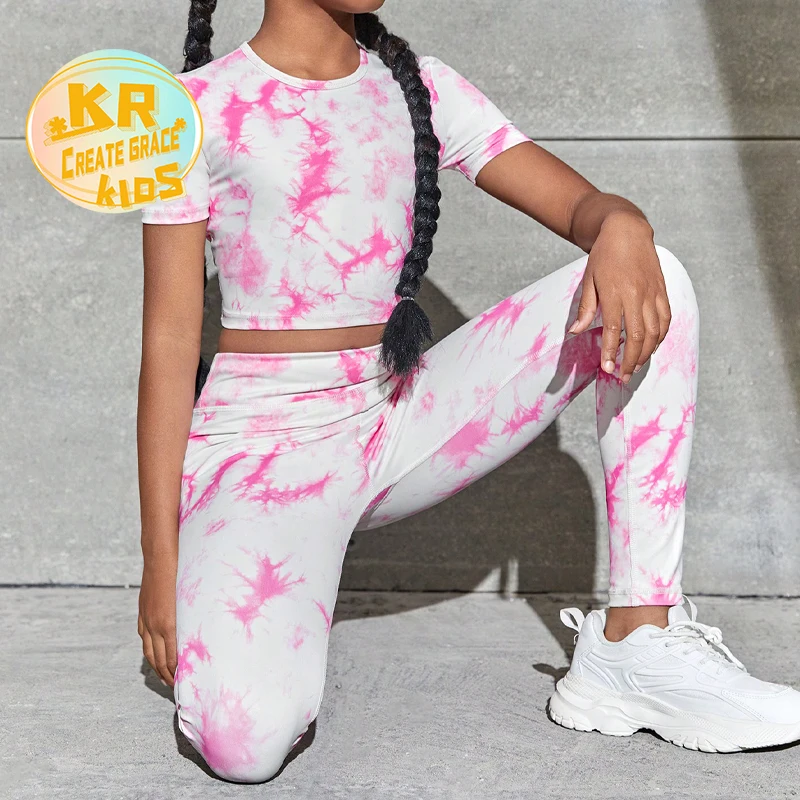 Colorful tie-dye kids' yoga outfit, perfect for wholesale buyers seeking vibrant, trendy activewear for young yoga enthusiasts.