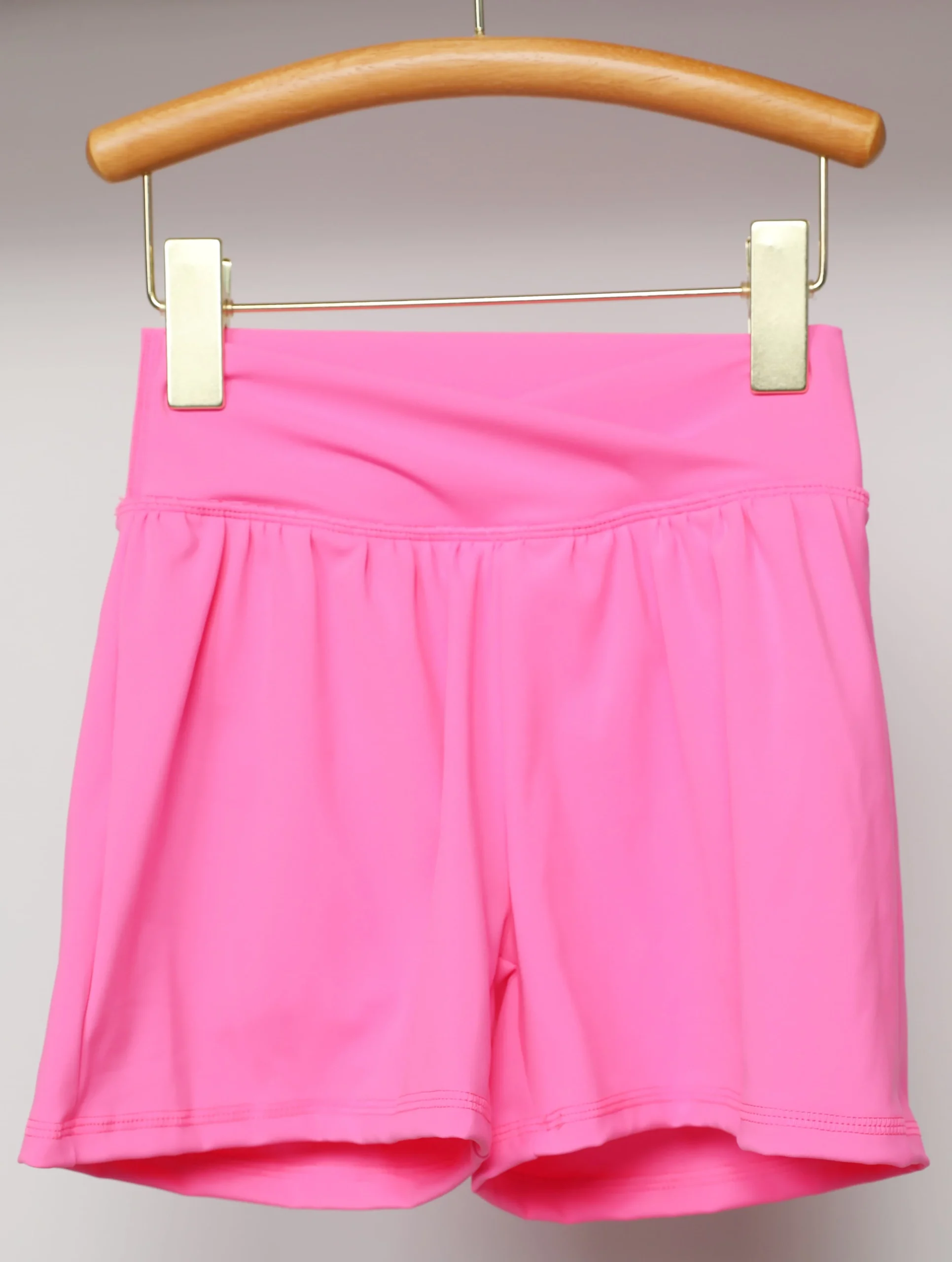 Group of confident kids practicing yoga together, showcasing activewear ideal for B2B wholesale in children's fitness apparel.