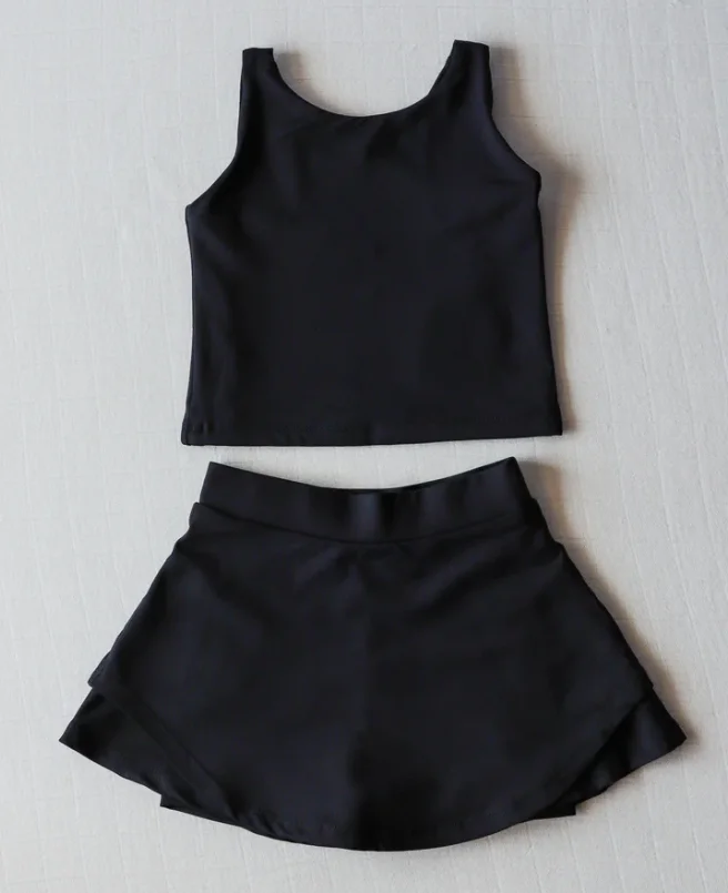 Wholesale sleeveless kids workout tanks in vibrant designs, perfect for activewear retailers seeking quality and stylish stock for young athletes.