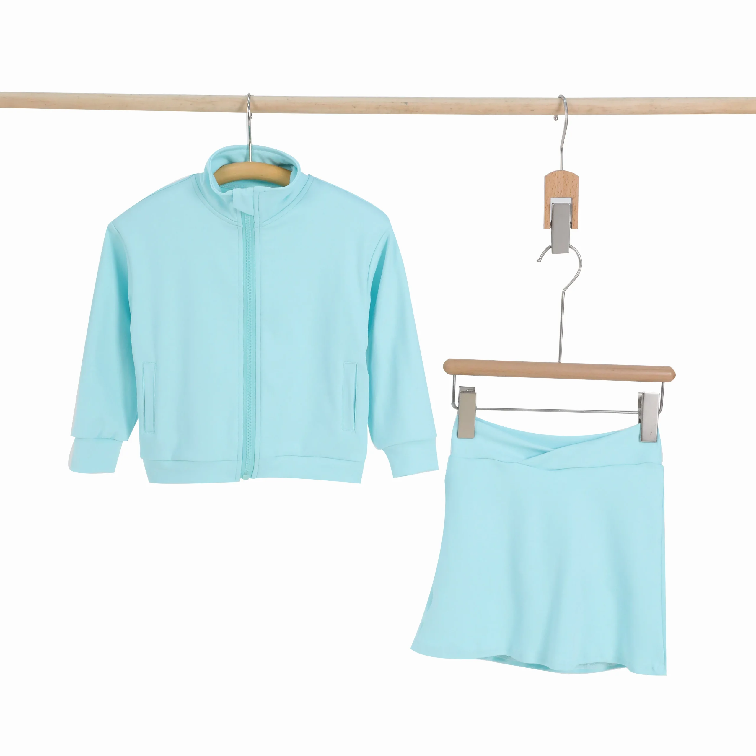 Girls in vibrant futuristic sports gear showcasing innovative designs, ideal for B2B wholesale buyers seeking cutting-edge athletic apparel solutions.