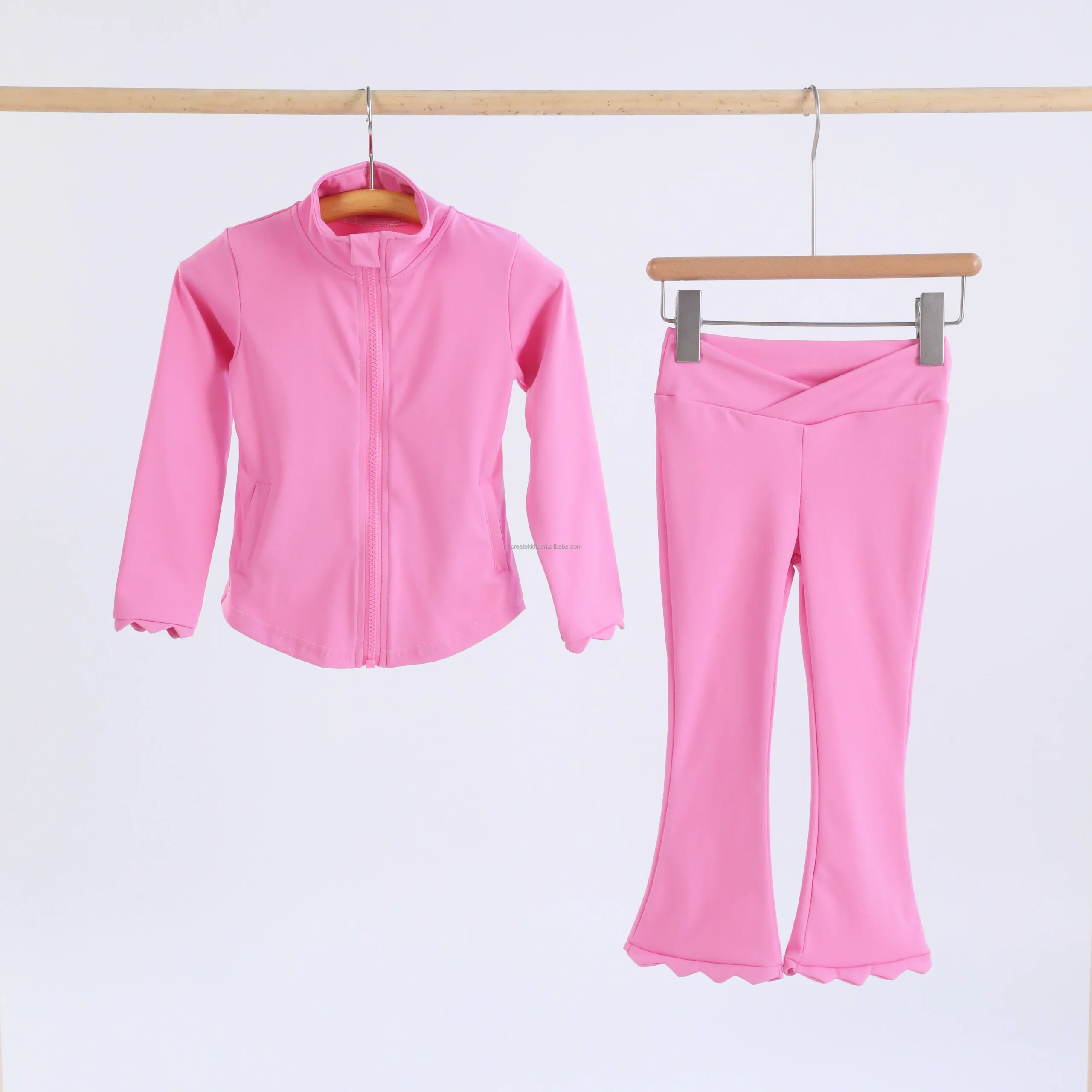 Happy families practicing yoga with kids, promoting wellness products for businesses offering wholesale fitness and lifestyle solutions.