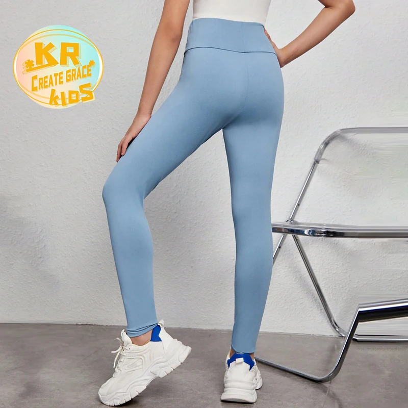 Pastel green kids yoga wear in soft, breathable fabric, ideal for B2B wholesale buyers seeking stylish, high-quality activewear for children.