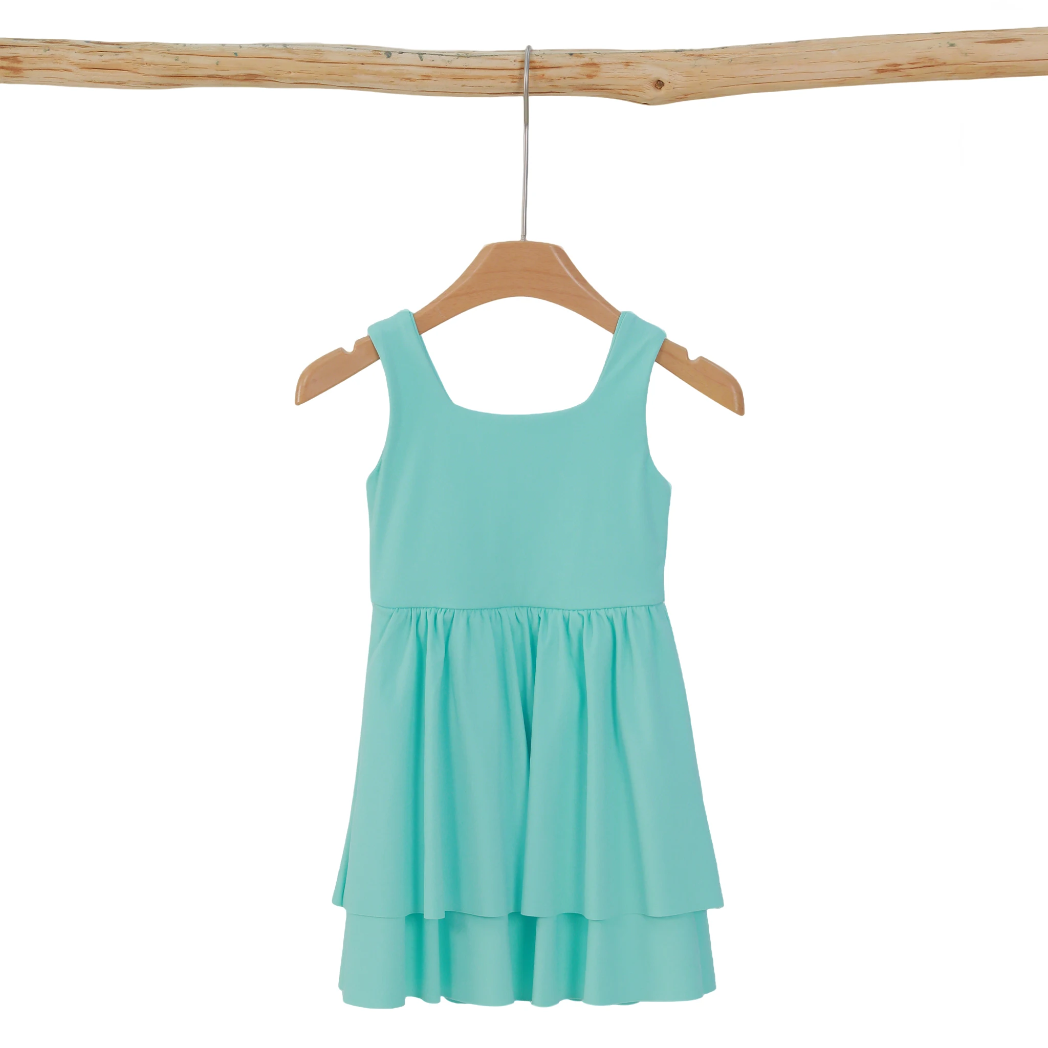 Wholesale kids' yoga wear displayed in a vibrant market setting, showcasing comfortable, high-quality apparel for B2B buyers.